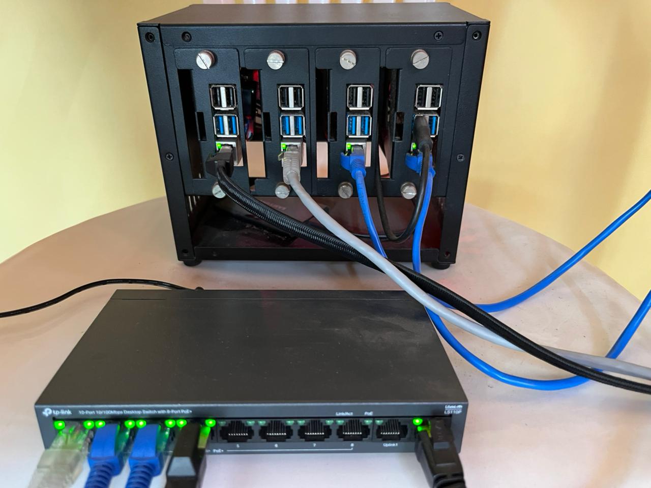 My Raspberry Pi cluster setup with UCTRONICS enclosure, PoE+ HATs, and TP-Link LS110P switch