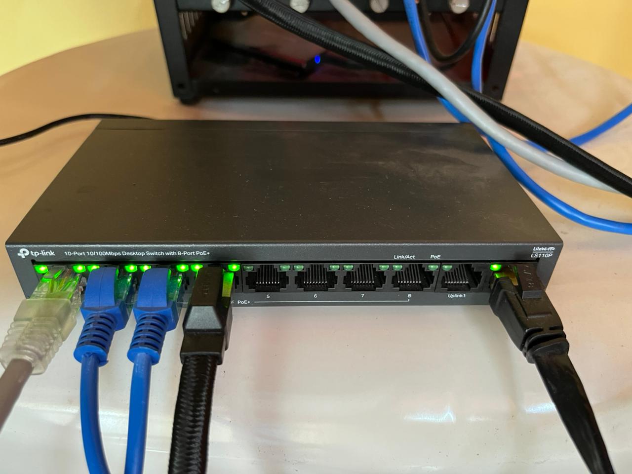 TP-Link Switch all plugged in with ethernet cables connecting to Pi cluster